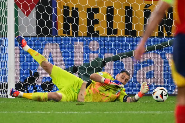 Gianluigi Donnarumma makes a save