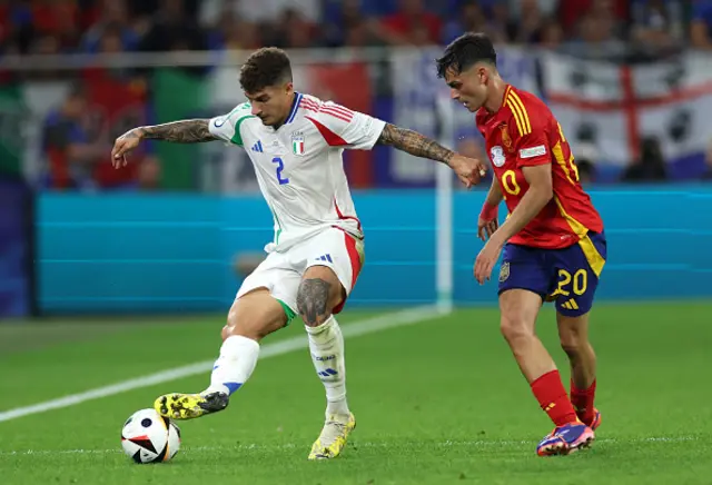 Giovanni Di Lorenzo of Italy controls the ball whilst under pressure from Pedri