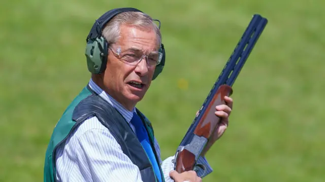 Nigel Farage holding a gun used for clay pigeon shooting