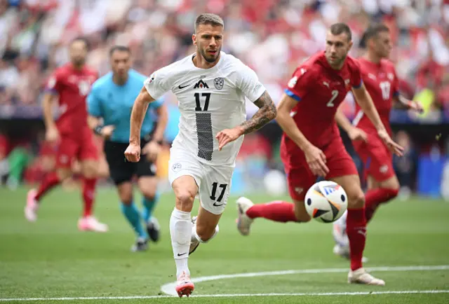 Jan Mlakar of Slovenia runs with the ball