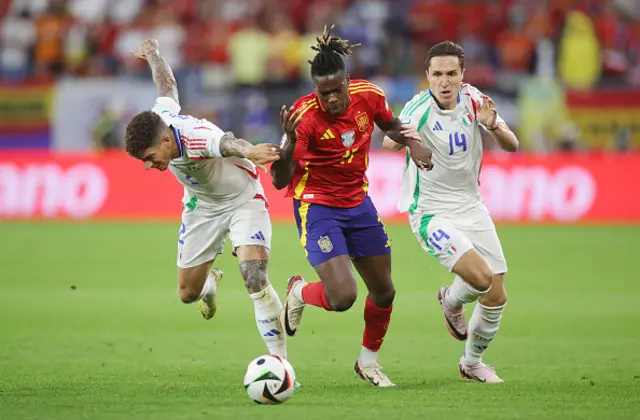 Giovanni Di Lorenzo of Italy, Nico Williams of Spain and Federico Chiesa of Italy compete for the ball