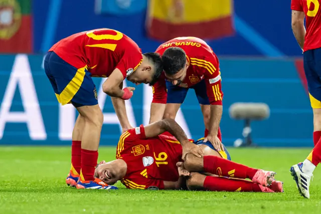 Rodri of Spain lies on the pitch with an injury