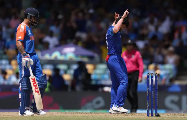 Fazalhaq Farooqi of Afghanistan celebrates the wicket of Rohit Sharma of India during the ICC Men's T20 Cricket World Cup West Indies & USA 2024 Super Eight matchFa