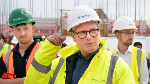 Keir Starmer in high vis at a building site