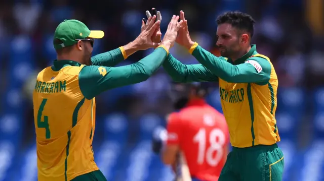 Keshav Maharaj and Aiden Markram celebrate the wicket of Jos Buttler