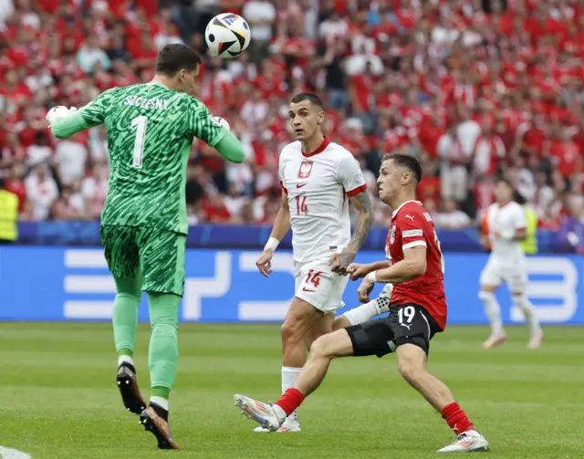 Poland's Goalkeeper Wojciech Szczesny clears the ball away