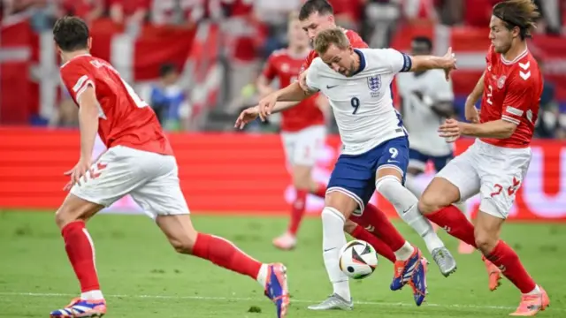 Harry Kane holds up the ball against Denmark