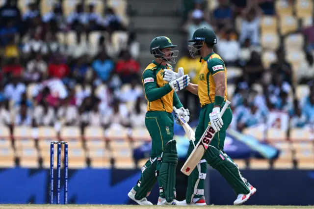 Quinton de Kock celebrates his half-century with Reeza Hendricks