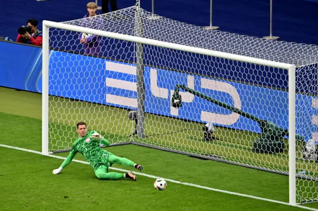 Poland goalkeeper Wojciech Szczesny fails to save a Austria penalty