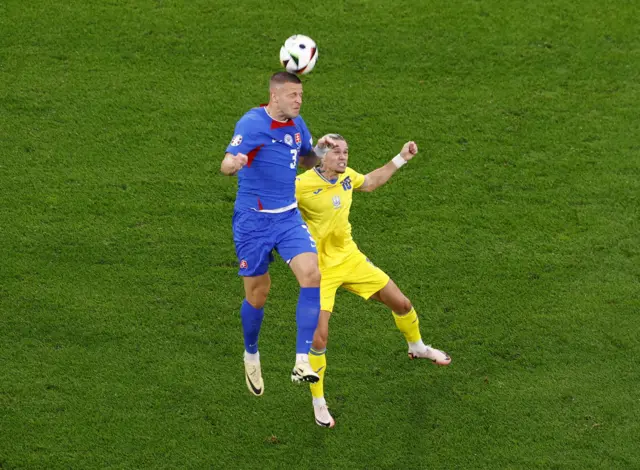 Ukraine's Mykhailo Mudryk in action with Slovakia's Denis Vavro