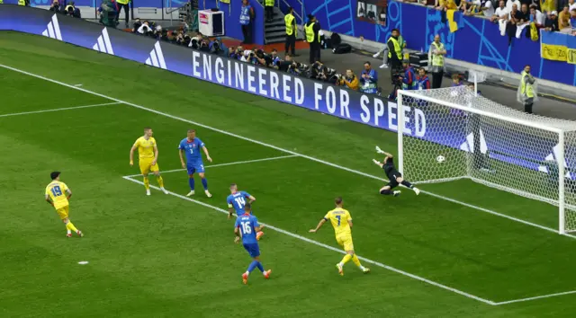 Ukraine's Mykola Shaparenko scores their first goal