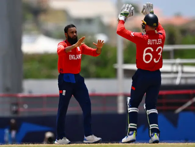 Adil Rashid and Jos Buttler celebrate a wicket