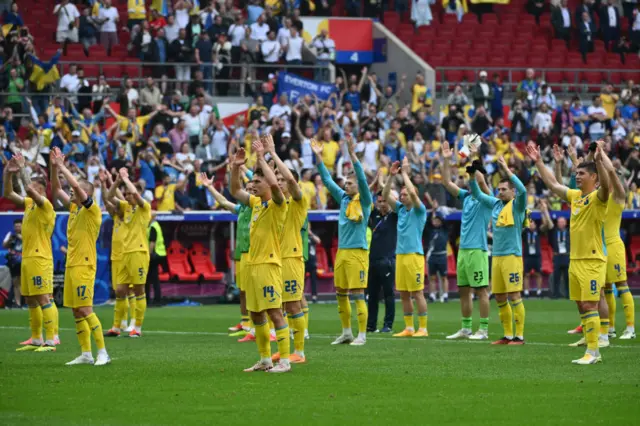 Ukraine players celebrate with fans