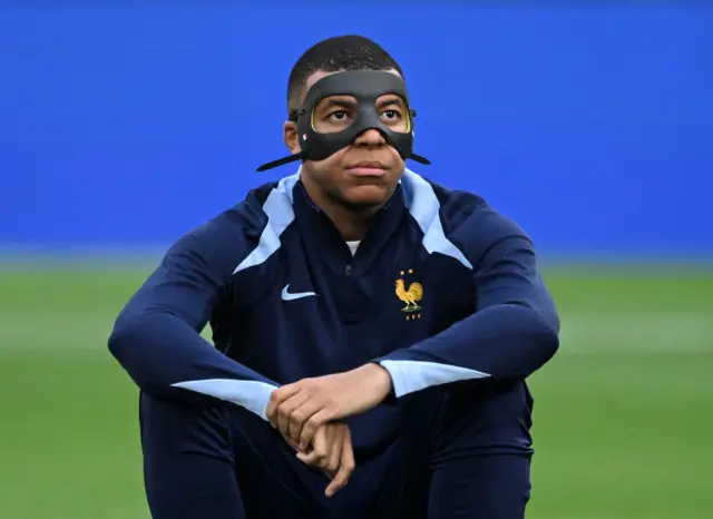 Kylian Mbappe with a mask on