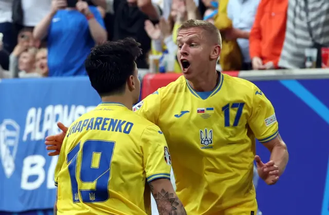 Mykola Shaparenko of Ukraine (L) celebrates scoring the 1-1 with Oleksandr Zinchenko