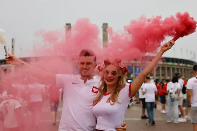 Polish fans let off flares outside the ground