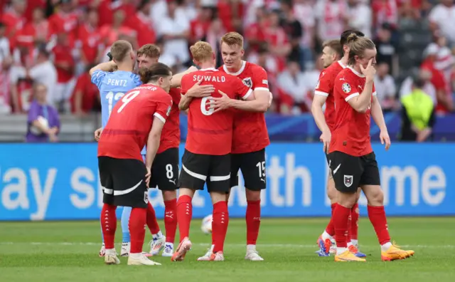 Philipp Lienhart and Nicolas Seiwald celebrate Austria win over Poland with teamates