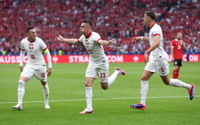 Poland striker Krzysztof Piatek celebrates scoring