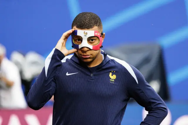 Kylian Mbappe with his France mask on