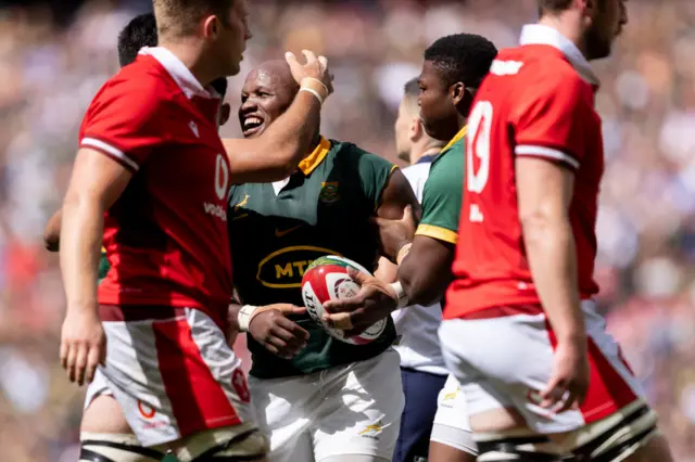 Mbongi Mbonami of South Africa celebrates with his teammates
