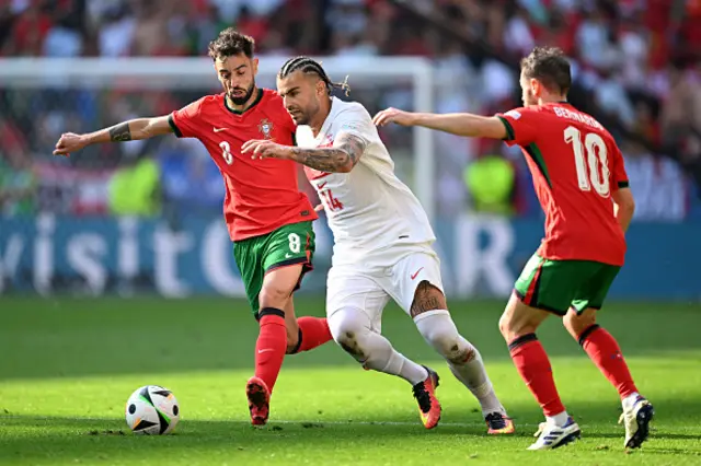 Abdulkerim Bardakci of Turkiye runs with the ball whilst under pressure from Bruno Fernandes and Bernardo Silva