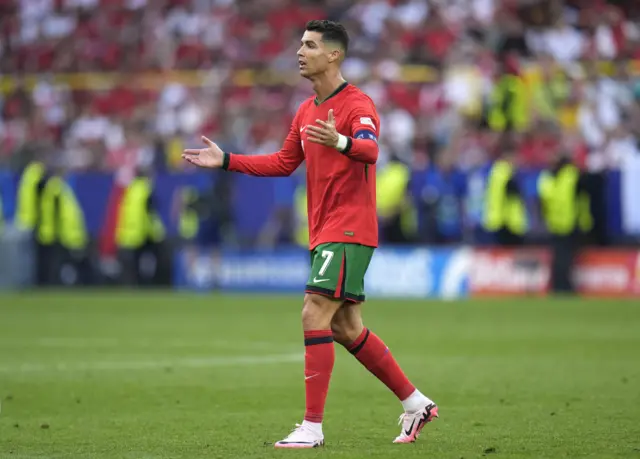 Ronaldo waves his arms in frustration