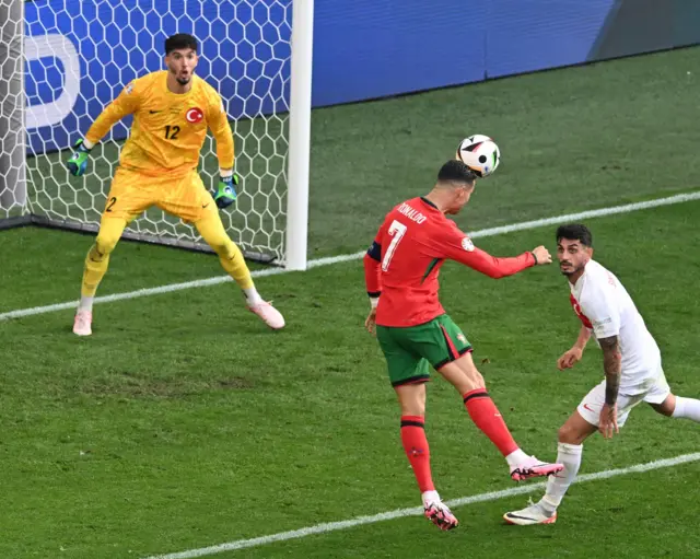 Ronaldo leaps high to head the ball