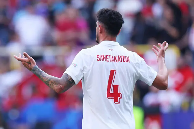 Samet Akaydin of Turkiye reacts after scoring an own-goal