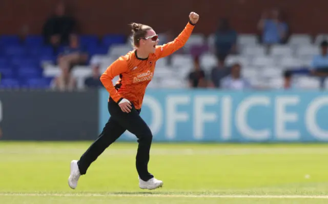 Linsey Smith celebrates taking the wicket of Sophia Dunkley