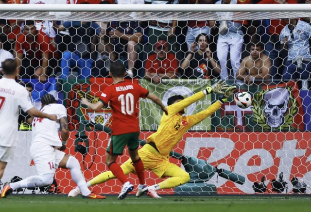 Portugal's Bernardo Silva scores their first goal past Turkey's Altay Bayindir