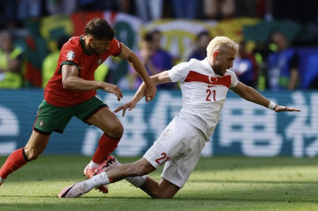 Portugal's Ruben Dias in action with Turkey's Baris Alper Yilmaz