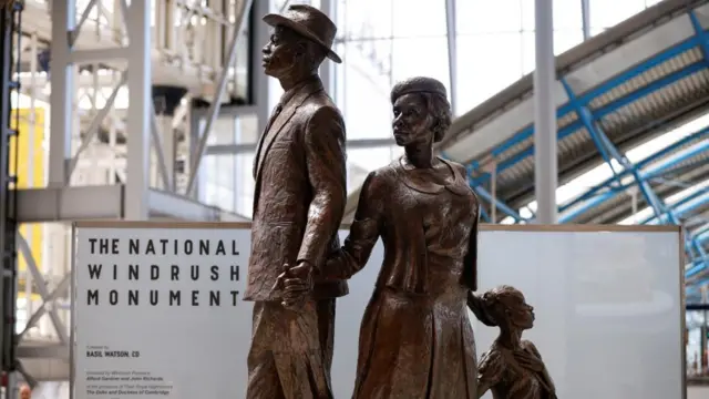 A monument of Windrush monument is seen at Waterloo station.