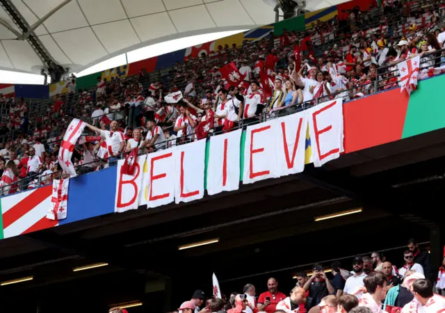 Believe banner in Georgia stand