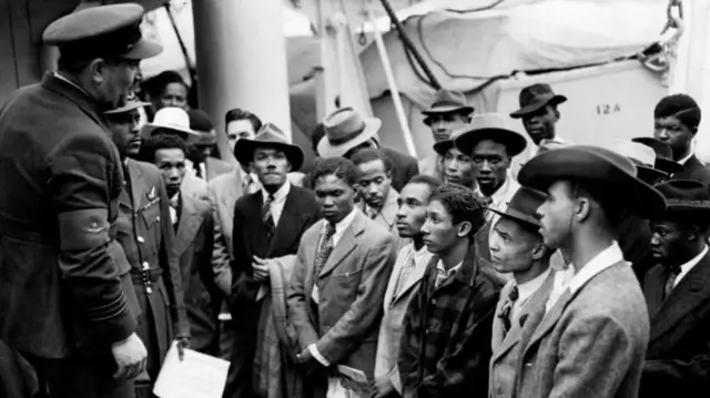 Jamaican immigrants welcomed by RAF officials from the Colonial Office after the ex-troopship HMT Empire Windrush landed them at Tilbury