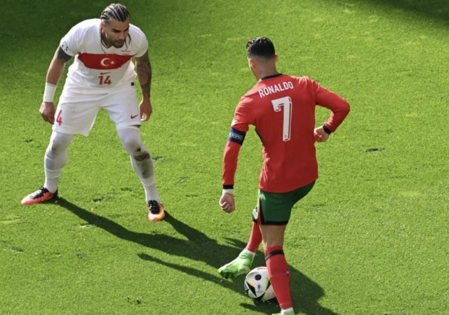 Portugal's Cristiano Ronaldo in action with Turkey's Abdulkerim Bardakci