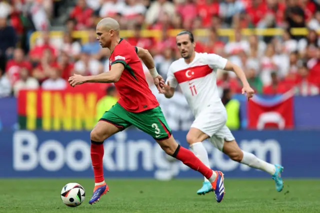 Pepe dribbles through the pitch with the ball