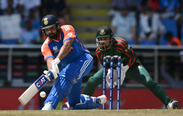 Rohit Sharma sweeps for four