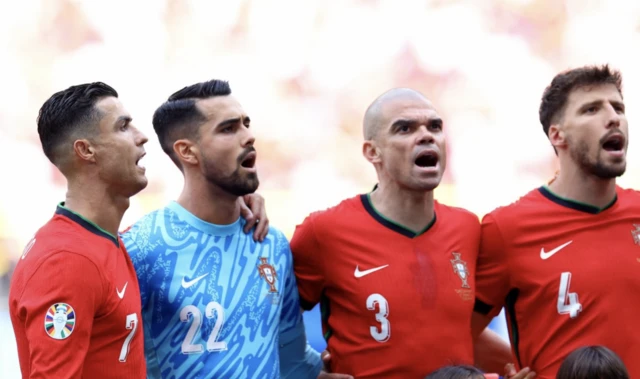 Portugal's Cristiano Ronaldo, Diogo Costa, Pepe and Ruben Dias line up with young mascots