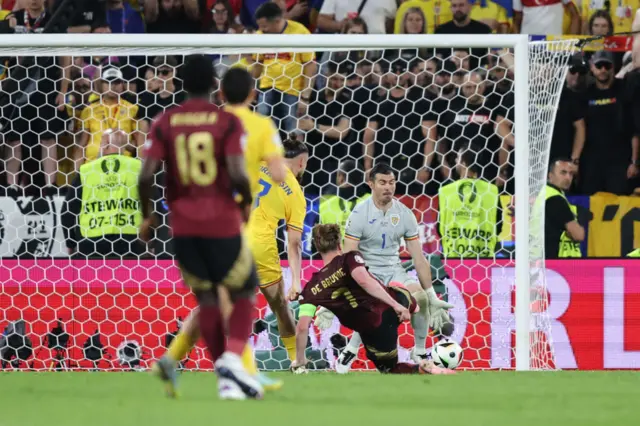 De Bruyne slides in to score the second for Belgium