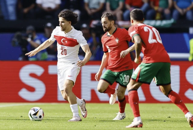 Turkey's Ferdi Kadioglu in action with Portugal's Bernardo Silva