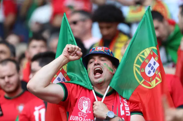 Portugal fan shakes his fist and shouts encouragement