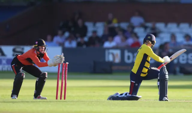 South East Stars batter Paige Scholfield is stumped by Sarah Bryce