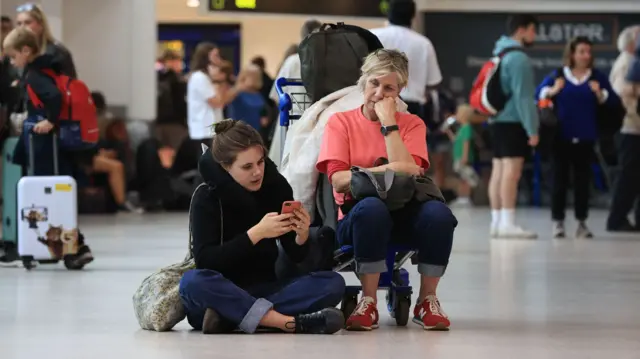 Passengers at Belfast International Airport during travel chaos seen over the August bank holiday of 2023