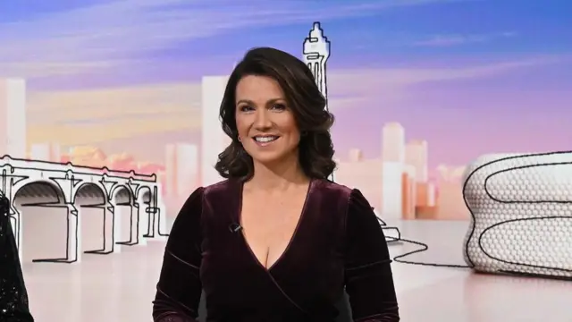 Susanna Reid, who presents ITV's Good Morning BRitain, smiling at the camera with background visuals from Laura Kuenssberg's Sunday show