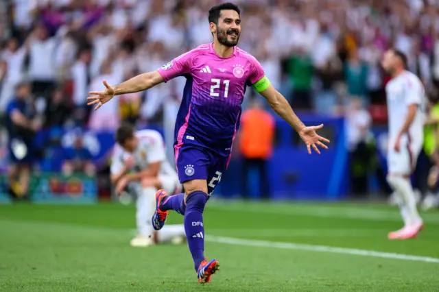 Gundogan runs to celebrate his goal v Hungary