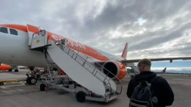 Bobbi’s partner Will Huyton boarding the plane this morning - before they were told to disembark