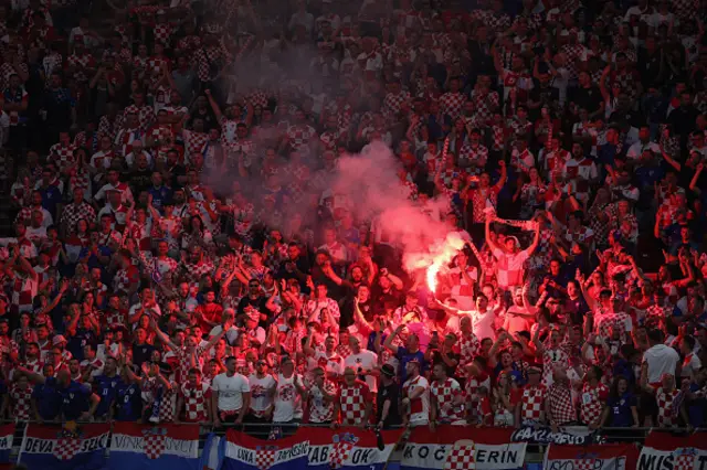 Croatia fans light flares in the crowd