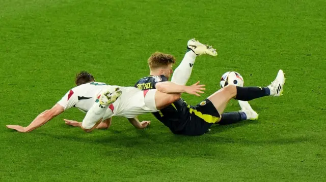 Penalty or not? Scotland's Stuart Armstrong and Hungary's Willi Orban clash in the box late in last night's game