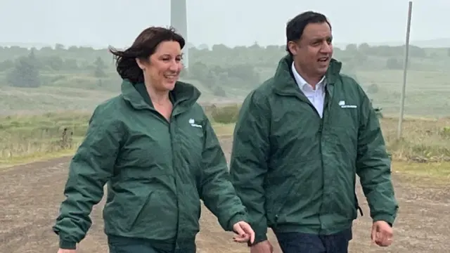 Rachel Reeves and Anas Sarwar at Whitelee complex, walking through a field