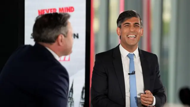 Rishi Sunak sits behind Harry Cole at the start of the Sun's election Q&A